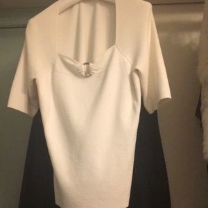 flattering sweater with gem on low neckline. great with jeans and dress pants